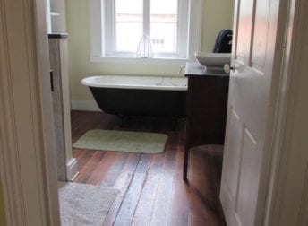 A Downtown Frederick bathroom remodel in a historic home that features a vessel bowl sink and clawfoot tub that fit the style of the house