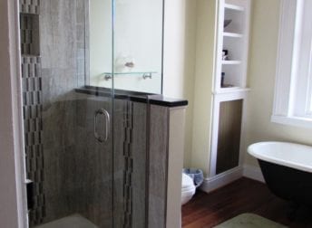 A Downtown Frederick bathroom remodel in a historic home that features a vessel bowl sink and clawfoot tub that fit the style of the house