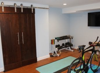 Who does home remodeling for a workout room in the basement. It also includes a laundry room and powder room