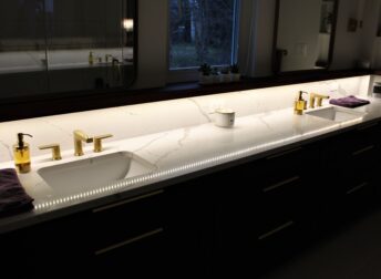 Check out the unique under shelf lighting in this Potomac Maryland master bathroom